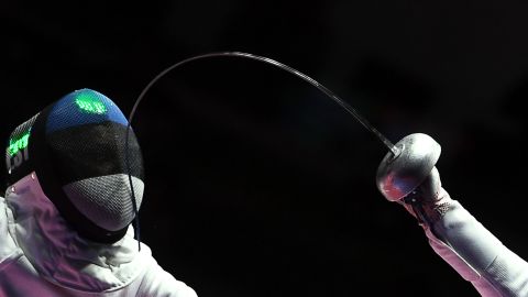 Estonian fencer Irina Embrich, left, competes in the team epee event.