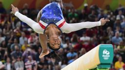 US gymnast Simone Biles competes in the beam event of the women's individual all-around final of the Artistic Gymnastics at the Olympic Arena during the Rio 2016 Olympic Games in Rio de Janeiro on August 11, 2016. / AFP / Emmanuel DUNAND        (Photo credit should read EMMANUEL DUNAND/AFP/Getty Images)