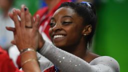 US gymnast Simone Biles reacts after seeing her score in the uneven bars event of the women's individual all-around final of the Artistic Gymnastics at the Olympic Arena during the Rio 2016 Olympic Games in Rio de Janeiro on August 11, 2016. / AFP / Ben STANSALL        (Photo credit should read BEN STANSALL/AFP/Getty Images)