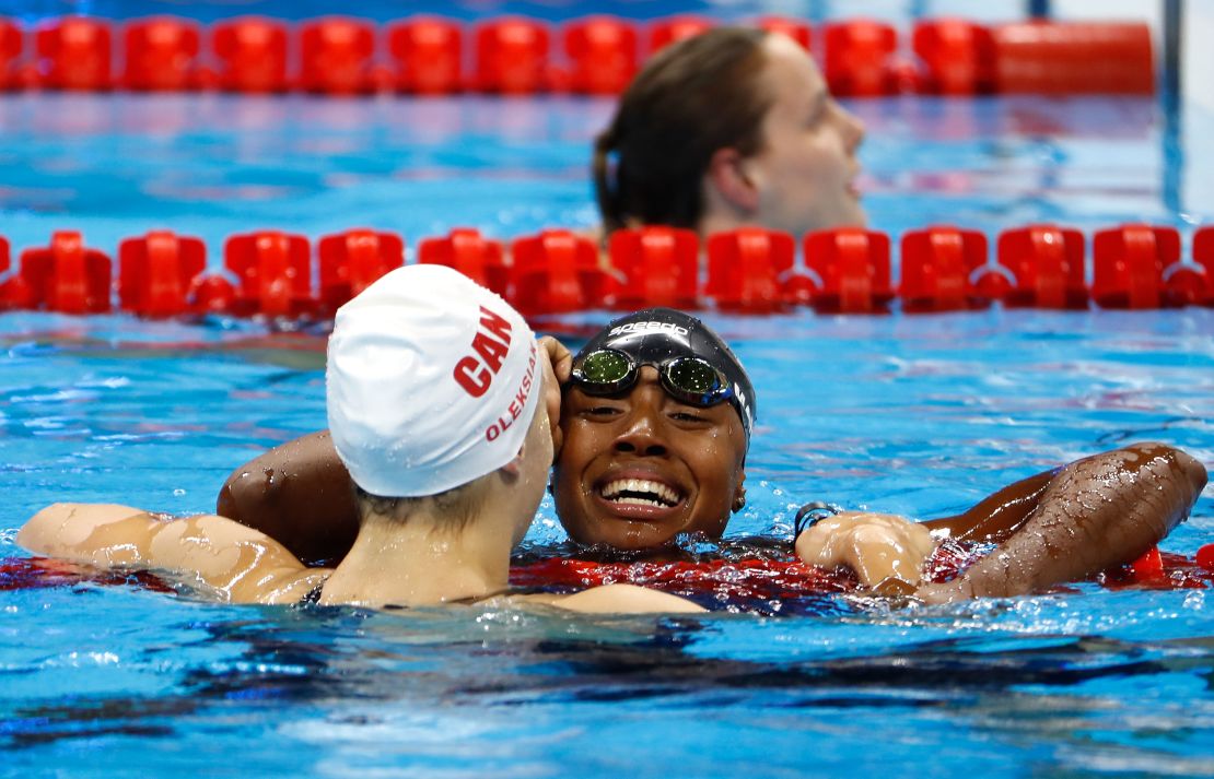 Simone Manuel and Penny Oleksiak of Canada embraced after their dead heat.