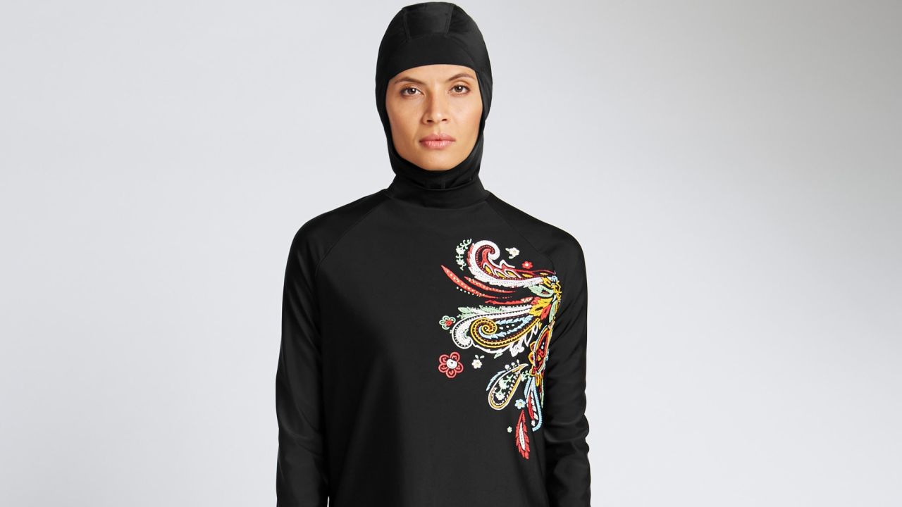 In a recent undated handout picture released by British retailer Marks and Spencer on April 8, 2016 a model poses wearing one of Marks and Spencer's full-body bathing suit or burkini suit.
From young start-ups to business giants, British entrepreneurs are eyeing a rapidly expanding global market for Muslim consumers with a range of brands from clothes to greetings cards to online gym courses. In contrast to France, where there has been an angry debate about Muslim-specific consumer products, the approach in Britain seems more business-minded. For example, famous names like the Marks & Spencer department store chain now offer Islamic fashion products.   / AFP PHOTO / MARKS AND SPENCER / Handout / RESTRICTED TO EDITORIAL USE - MANDATORY CREDIT  " AFP PHOTO / MARKS AND SPENCER "  -  NO MARKETING NO ADVERTISING CAMPAIGNS   -   DISTRIBUTED AS A SERVICE TO CLIENTS HANDOUT/AFP/Getty Images