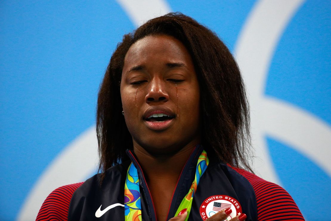 An emtional Simone Manuel on the medal podium 