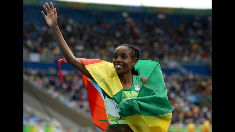 Ethiopia's Almaz Ayana celebrates after winning the 10,000 meters. She stunned spectators by crossing the line in 29 minutes, 17.45 seconds, <a href="index.php?page=&url=http%3A%2F%2Fwww.cnn.com%2F2016%2F08%2F12%2Fsport%2Frio-olympics-ethiopia-10000m-world-record%2Findex.html" target="_blank">smashing a record</a> that had stood for nearly 23 years.