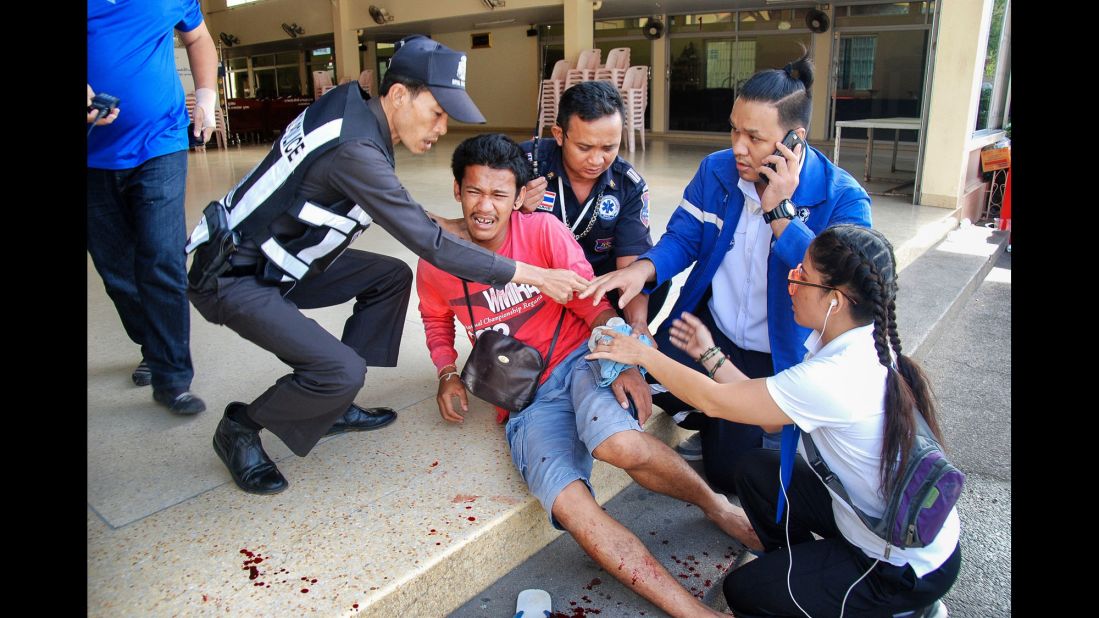 A victim is treated for injuries at the site of a bomb explosion in Hua Hin on Friday, August 12. No one has claimed responsibility for the blasts but Thai police say there's no evidence the attacks are related to international terrorism.