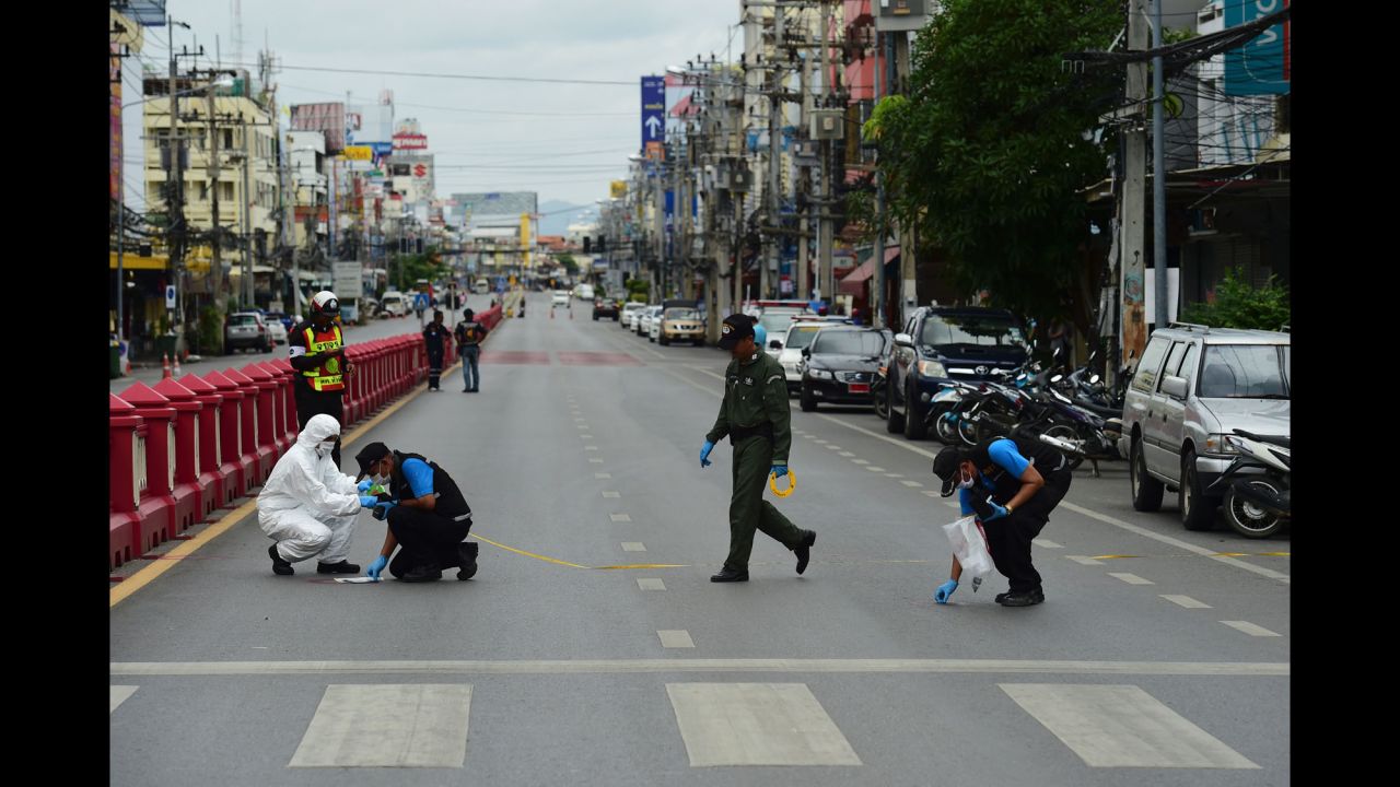 Forensic police gather evidence at the scene of a small blast in Hua Hin on August 12.
