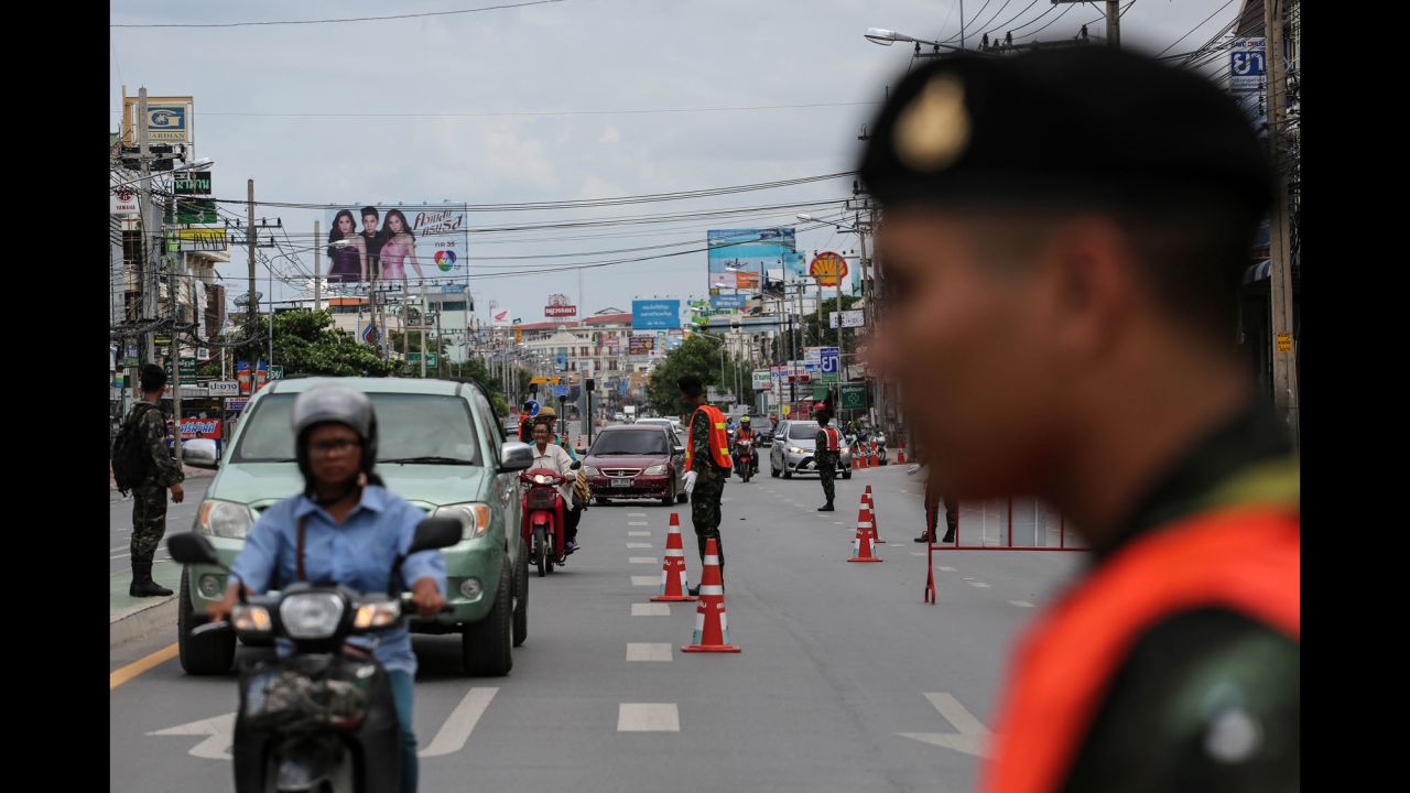 Thai Army officers direct traffic on Friday, August 12 near the site of coordinated blasts in Hua Hin.