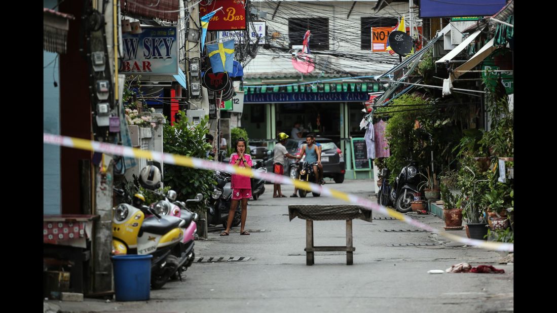 A girl looks at the scene of an explosion on Friday, August 12 in Hua Hin, Thailand.