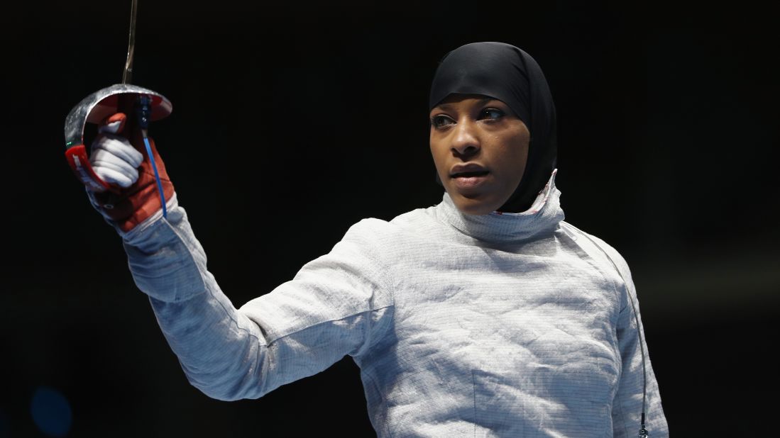 Ibtihaj Muhammad competed in the women's individual sabre, earning her the title of first U.S. athlete to compete wearing a hijab, a religious head covering sometimes worn by Muslim women. 