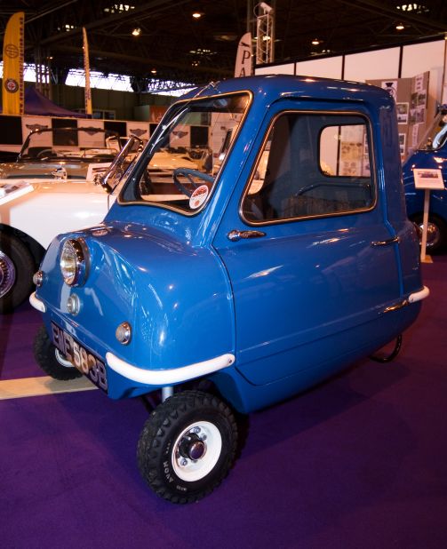 The Peel P50 holds the Guinness World Record for being the smallest production car. It is just 1.3 meters (4.3 feet) long, holds only one occupant and has no reverse gear; you pick it up and swing it around if you need to make a tight maneuver.