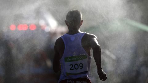Artur Brzozowski, a race walker from Poland, makes his way through the mist during the 20-kilometer event.
