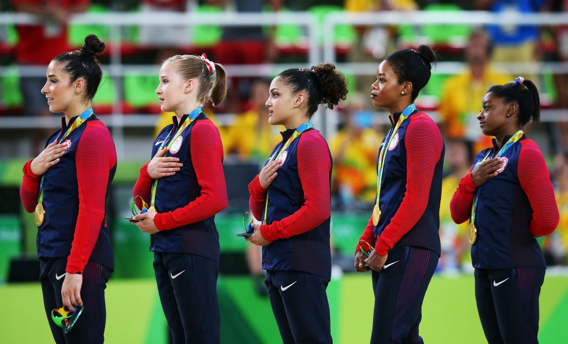 Team USA gold medalists Lauren Hernandez, Gabrielle Douglas and Simone Biles, from left,  during the medal ceremony in Rio. 