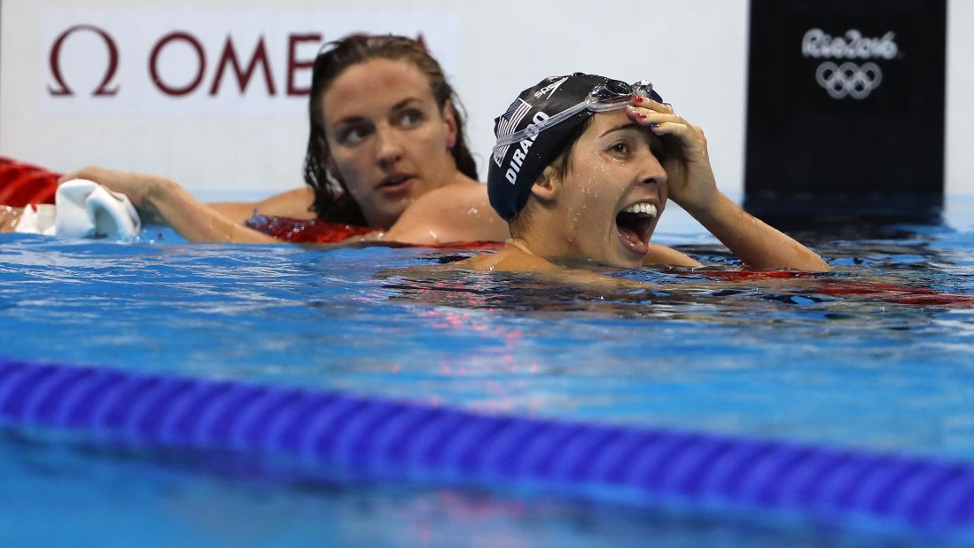 Maya DiRado, right, looks up at her time after winning the 200-meter backstroke. DiRado was trailing Hungary's Katinka Hosszu, left, for much of the race but edged her at the end. It is DiRado's second gold medal in Rio.