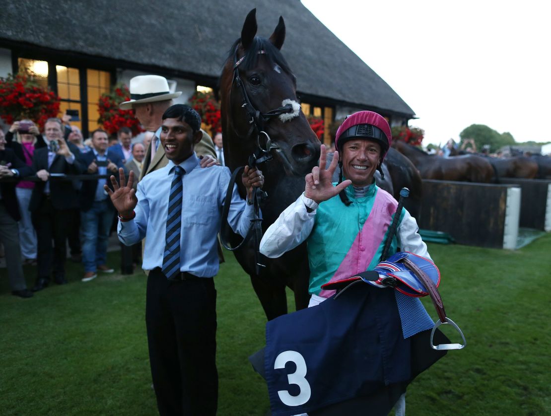 Frankie Dettori celebrates after riding his 3000th British winner on Predilection at Newmarket.