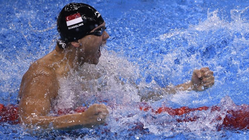 Singapore's Joseph Schooling celebrates after the Men's 100m Butterfly Final during the swimming event at the Rio 2016 Olympic Games at the Olympic Aquatics Stadium in Rio de Janeiro on August 12, 2016.   / AFP / Martin BUREAU        (Photo credit should read MARTIN BUREAU/AFP/Getty Images)