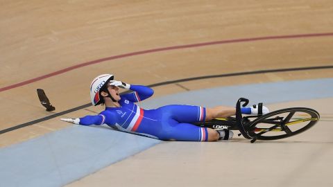 France's Virginie Cueff reacts after falling in the keirin first round track cycling event.