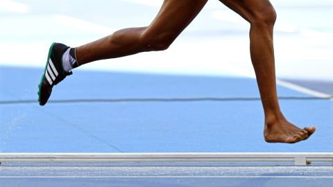 Etenesh Diro of Ethiopia loses her shoe during the women's 3,000-meter steeplechase heats.