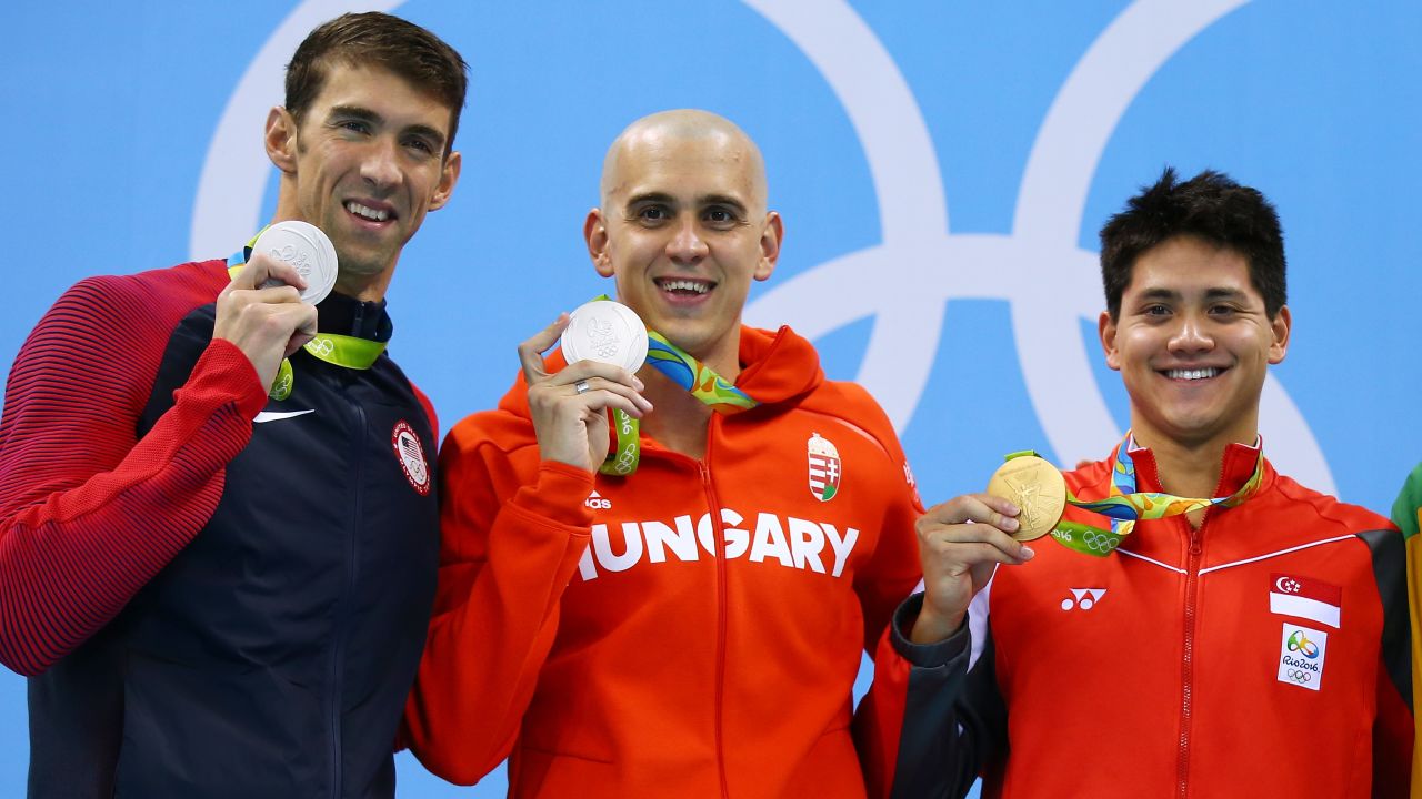 Joint silver medalists, Michael Phelps of United States and Laszlo Cseh of Hungary and gold medalist Joseph Schooling of Singapore celebrate on the podium during the medals ceremony in the Men's 100m butterfly final.