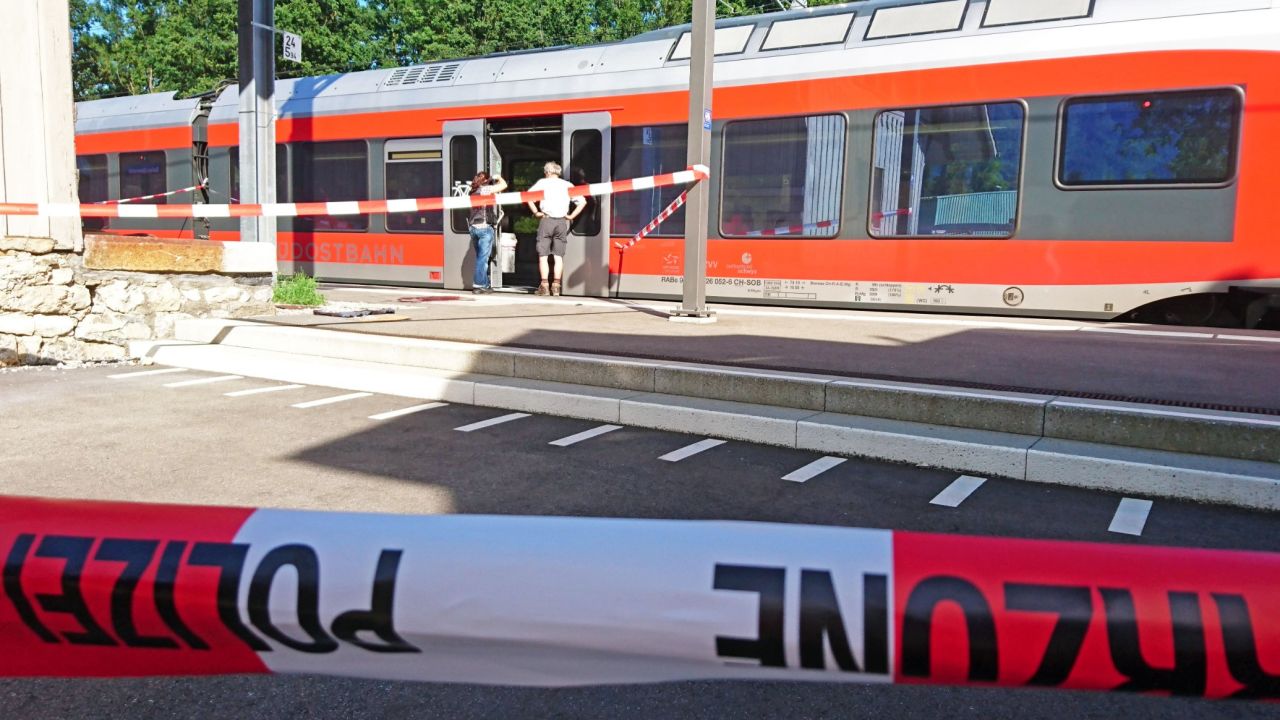 Policemen stand by a train at the station in Salez, eastern Switzerland, after a man set a fire and stabbed passengers on August 13, 2016.
A man set a train carriage in Switzerland on fire using a flammable liquid and stabbed passengers, injuring six people including a six-year-old child, police said. / AFP / newspictures.ch / Beat KAELIN / Switzerland OUT / MANDATORY MENTION OF THE CREDIT "AFP PHOTO/NEWSPICTURES.CH/BEAT KAELIN"        (Photo credit should read BEAT KAELIN/AFP/Getty Images)