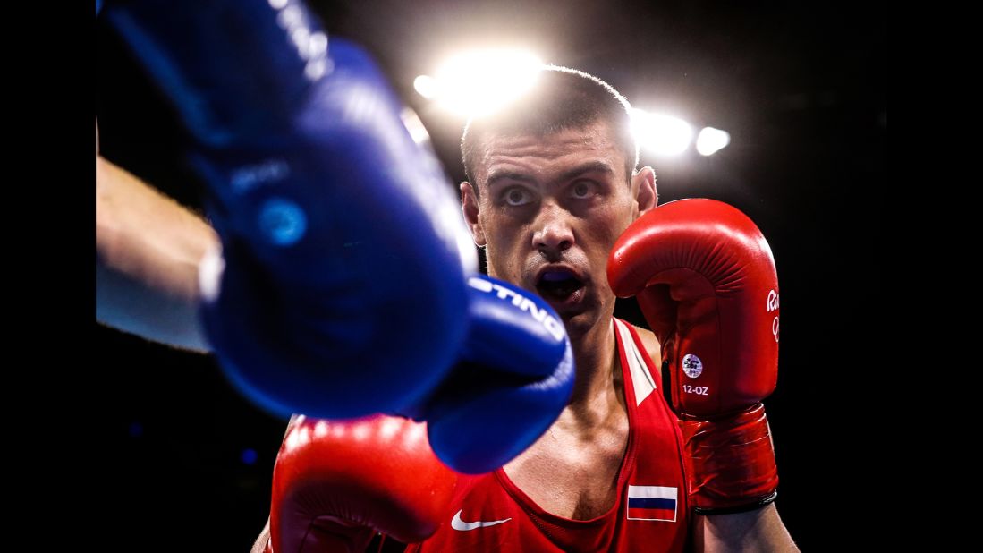 Russian boxer Evgeny Tishchenko won his heavyweight 91-kilogram (201-pound) semifinal bout against Uzbekistan's Rustam Tulaganov and will go for gold on Monday.