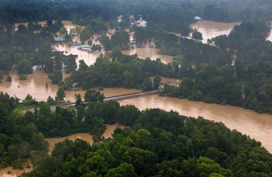 The Tangipahoa River overflows near the towns of Amite, Independence, Tickfaw and Robert on August 13.