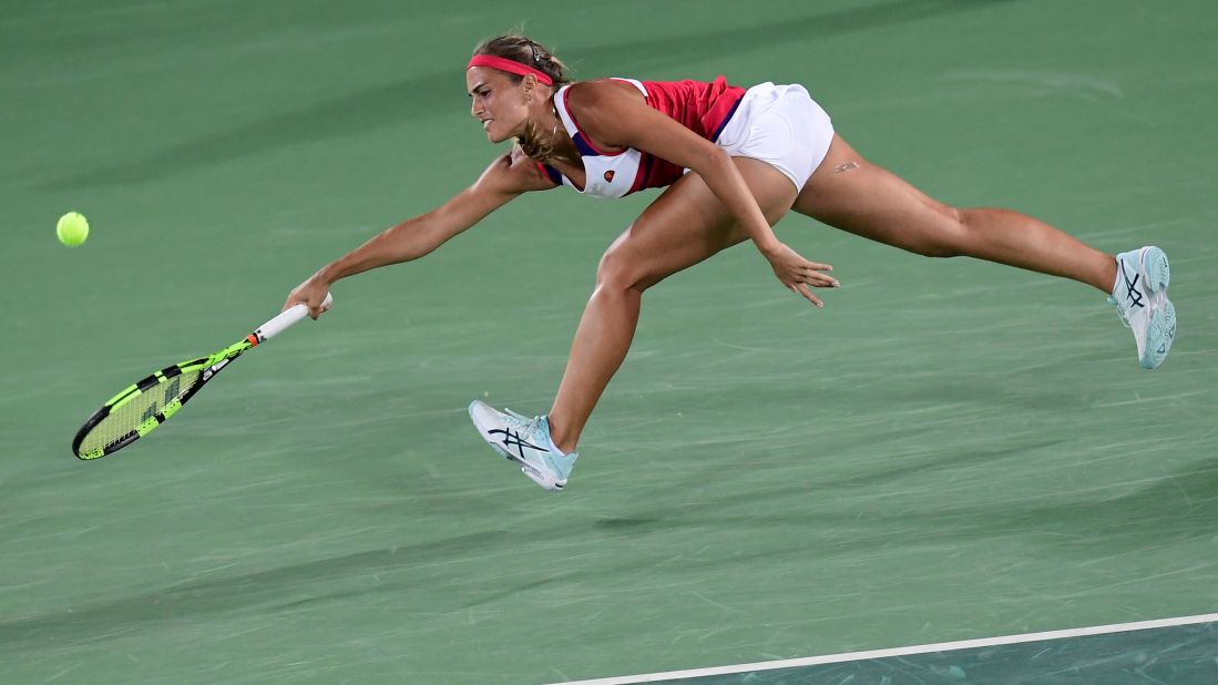 Puerto Rico's Monica Puig goes for the ball during her singles final tennis match against Germany's Angelique Kerber.