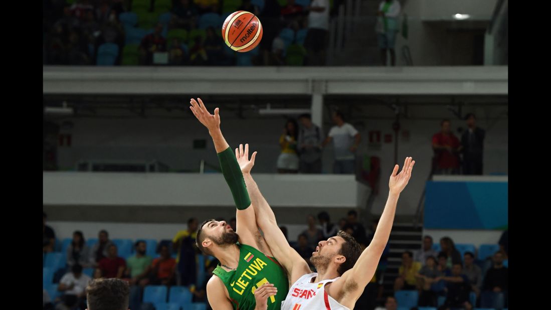 Jonas Valanciunas of Lithuania, left, and Spain's Pau Gasol face off in a preliminary basketball match. Spain won 109-59.
