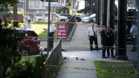 Sandals remain on a New York sidewalk near the scene of the fatal shooting Saturday of Imam Maulama Akonjee and his assistant.