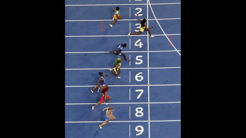 Jamaica's Elaine Thompson, second from top, wins the 100-meter final on Saturday, August 13. Third-placed teammate Shelly-Ann Fraser-Pryce fell short in her bid to win the event for a record third successive Olympics.