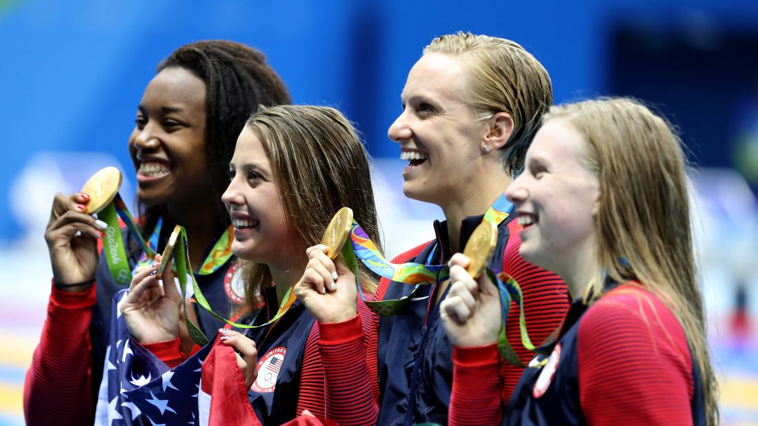 Simone Manuel, Kathleen Baker, Dana Vollmer and Lilly King of the US swim team pose with their gold medals after winning the 4x100-meters medley relay. 