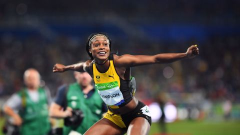 Elaine Thompson celebrates after taking gold in the women's 100 meters.