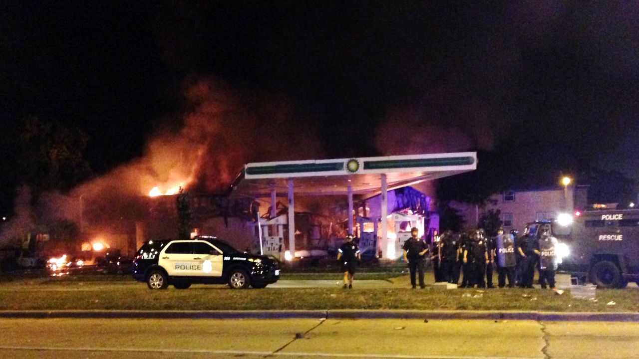 Protesters clash with police Saturday night in Milwaukee.