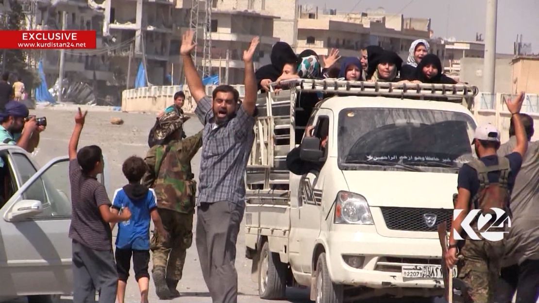 Residents celebrate the Kurdish liberation of Manbij from ISIS.
