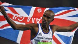 Britain's Mo Farah celebrates winning the Men's 10,000m during the athletics event at the Rio 2016 Olympic Games at the Olympic Stadium in Rio de Janeiro on August 13, 2016.   / AFP / Fabrice COFFRINI        (Photo credit should read FABRICE COFFRINI/AFP/Getty Images)