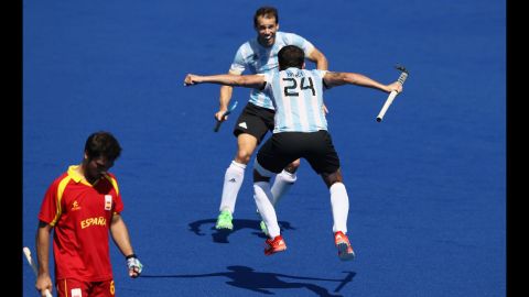 Facundo Callioni of Argentina celebrates with team mate Manuel Brunet after their 2-1 victory in a field hockey match against Spain.