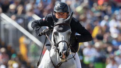 Philippe Rozier of France, riding Rahotep De Toscane, looks ahead during the Jumping Individual and Team Qualifier.