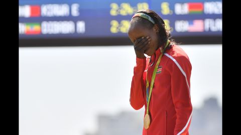 Jemima Sumgong of Kenya becomes emotional during the podium ceremony for the Women's Marathon on Sunday, August 14. Sumgong is the first woman to win a gold medal in Olympic Marathon running for Kenya.