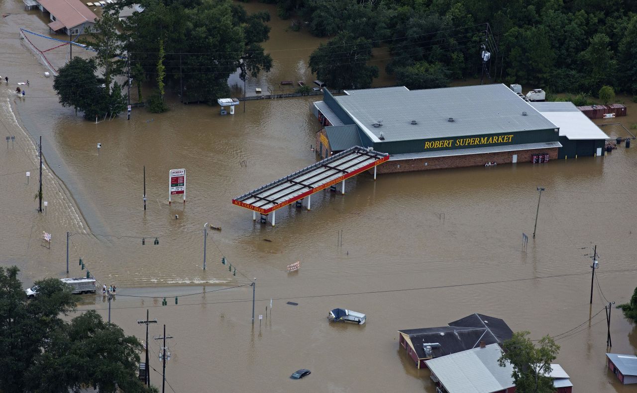 Floodwaters overwhelm businesses in Hammond on August 13.