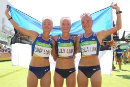 Liina Luik, Lily Luik, and Leila Luik of Estonia pose after the Women's Marathon