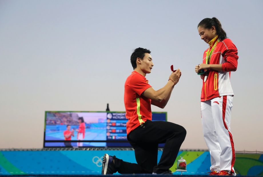 Chinese diver Qin Kai proposes to silver medalist diver He Zhi.