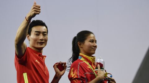Qin gives the thumbs up to the crowd after the proposal.