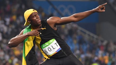 Bolt does his "Lightening Bolt' pose as he celebrates winning the 100 meters.