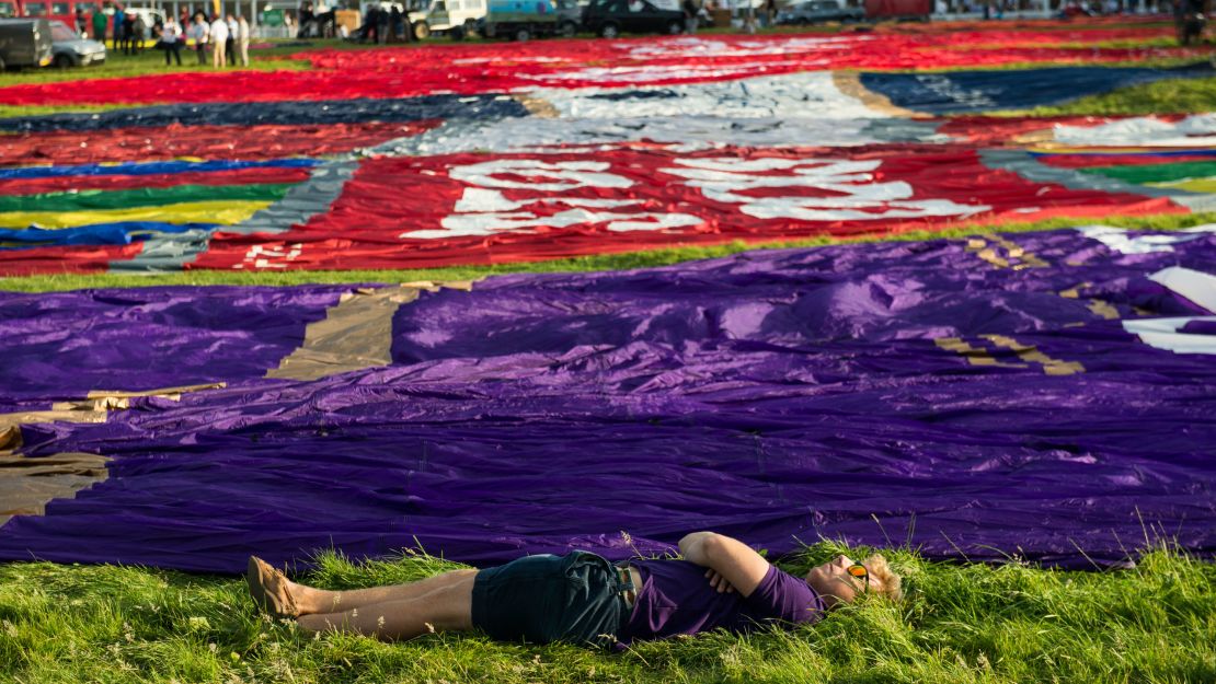 Mass ascents scheduled for Friday and early Saturday couldn't take place due to windy weather. But dozens managed to get off the ground on Saturday evening and again Sunday, much to the delight of the crowd. 