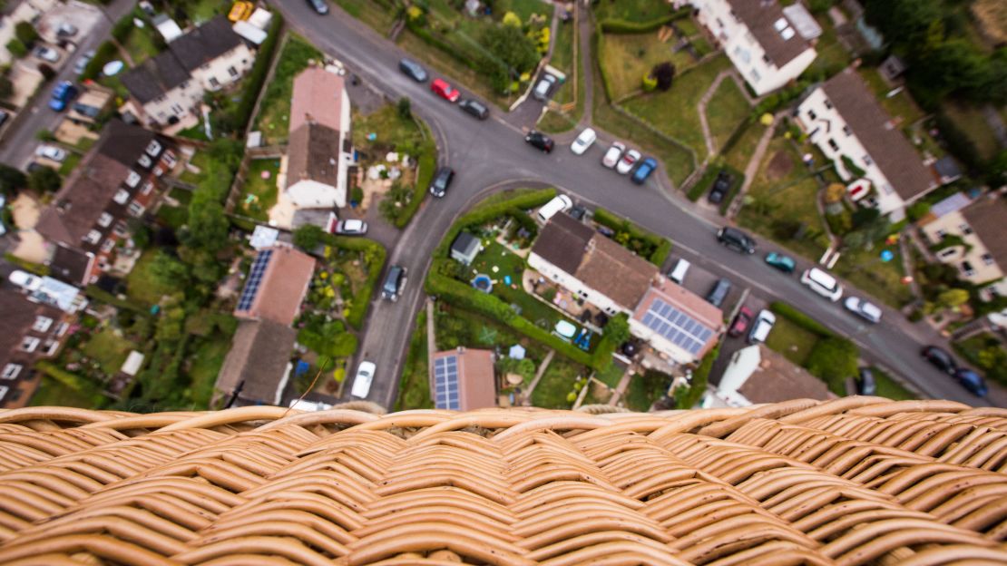 The wicker basket of the Fortnum & Mason balloon is seen high above the town of Long Ashton, four miles west of Bristol. Despite many decades of balloon manufacturing and development, traditional cane wicker is still the preferred material for balloon baskets, due to its lightweight and durable flexibility.