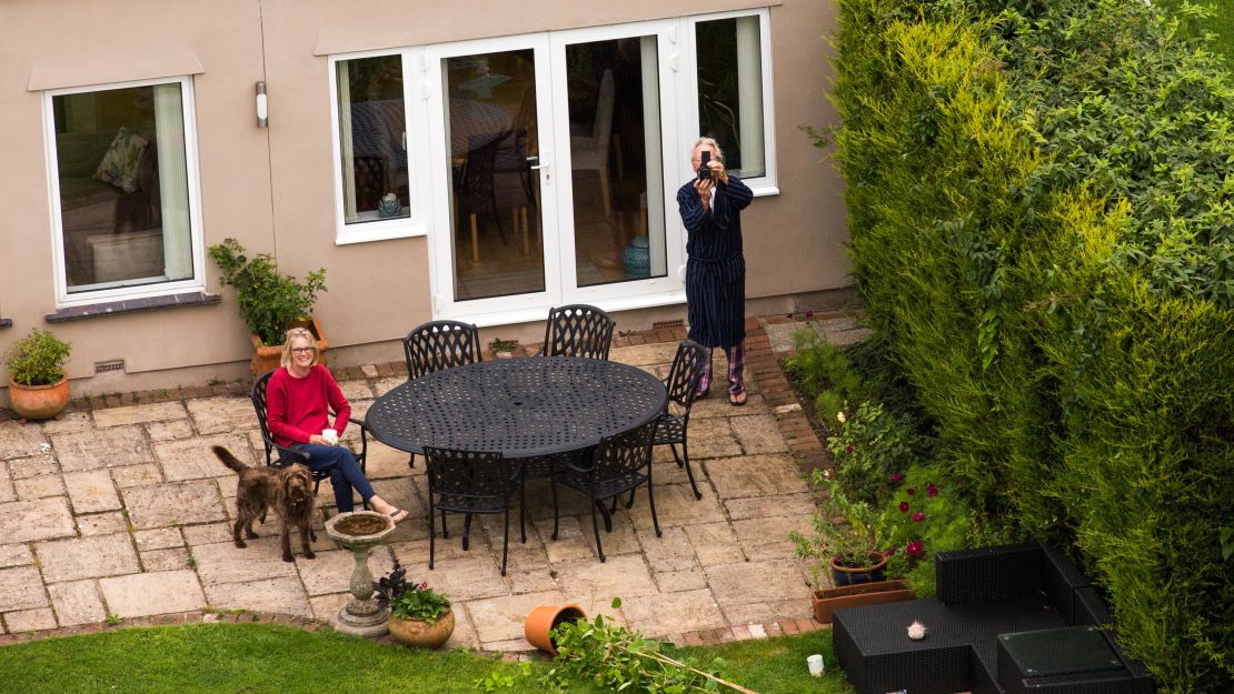 The aircraft could be seen for miles around during the mass ascents. A couple watches the Fortnum & Mason balloon pass over their back garden in Long Ashton.