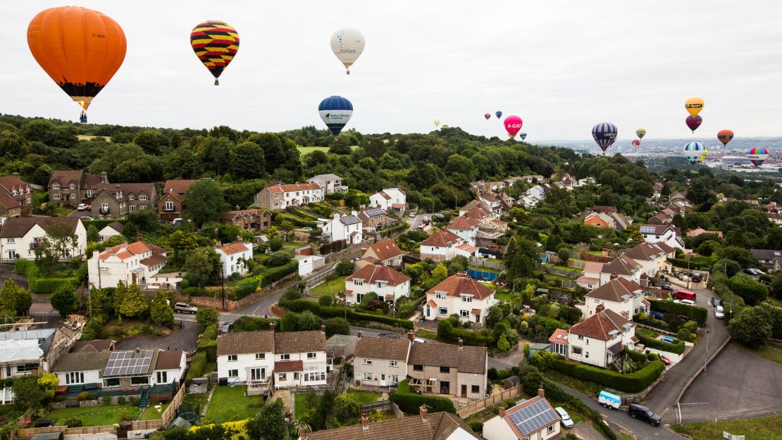 An armada of balloons drifts over Long Ashton, near the fiesta site. 