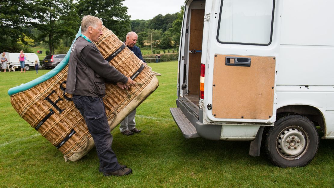 David Bareford, left, and John Coleman load the Fortnum & Mason basket into a van, before returning to Ashton Court Sunday. Over the course of his balloon piloting days in Kenya, Coleman says he flew 38,000 passengers, including Al Gore. "I always say about ballooning, we're in the happiness and memory business."