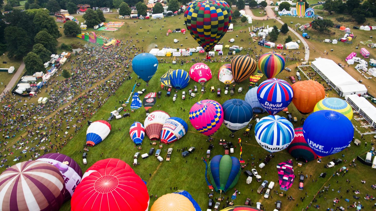 An aerial view of the launch field at Ashton Court shows balloons preparing for the mass lift Sunday
