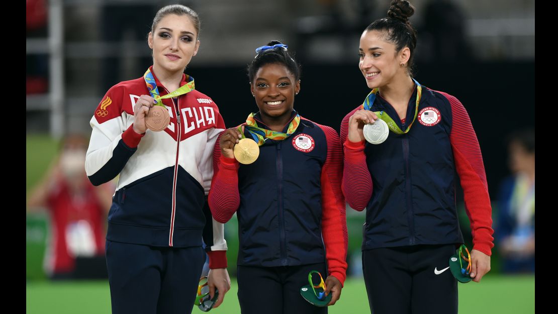 Aliya Mustafina, Simone Biles, and Alexandra Raisman on the medal stand at the 2016 Rio Olympics.