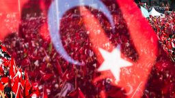 People wave Turkish flags during a rally organised by the main opposition group, the secular and centre-left Republican People's Party (CHO), on July 24, 2016 in Istanbul's Taksim square.
Many thousands of flag-waving Turks massed on July 24, 2016 for the first cross-party rally to condemn the coup attempt against President Recep Tayyip Erdogan, amid an ongoing purge of suspected state enemies. Istanbul's Taksim square was transformed into a sea of red national flags in what was dubbed a "democracy festival". But in stark contrast to the celebratory and patriotic mood in Istanbul, human rights group Amnesty International in London claimed it had "credible evidence" of the beating and torture of detainees. / AFP / GURCAN OZTURK        (Photo credit should read GURCAN OZTURK/AFP/Getty Images)