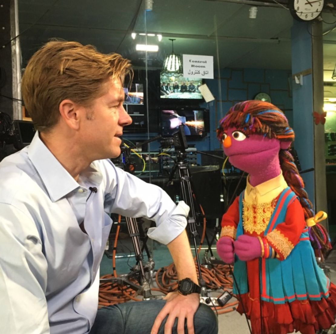 CNN's Ivan Watson talks with a Muppet.